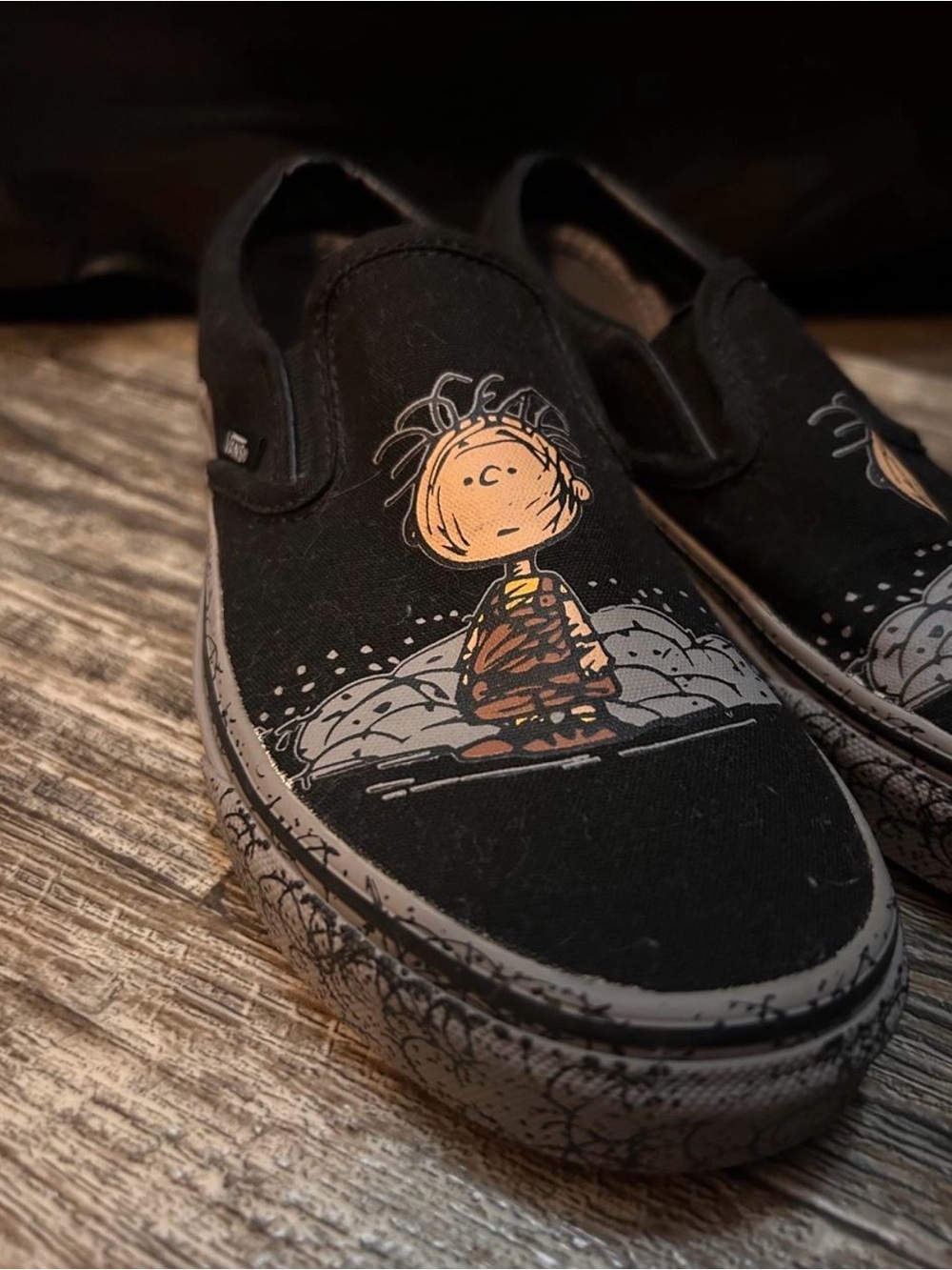 Vans Black Slip-On Sneakers with Peanuts Graphic